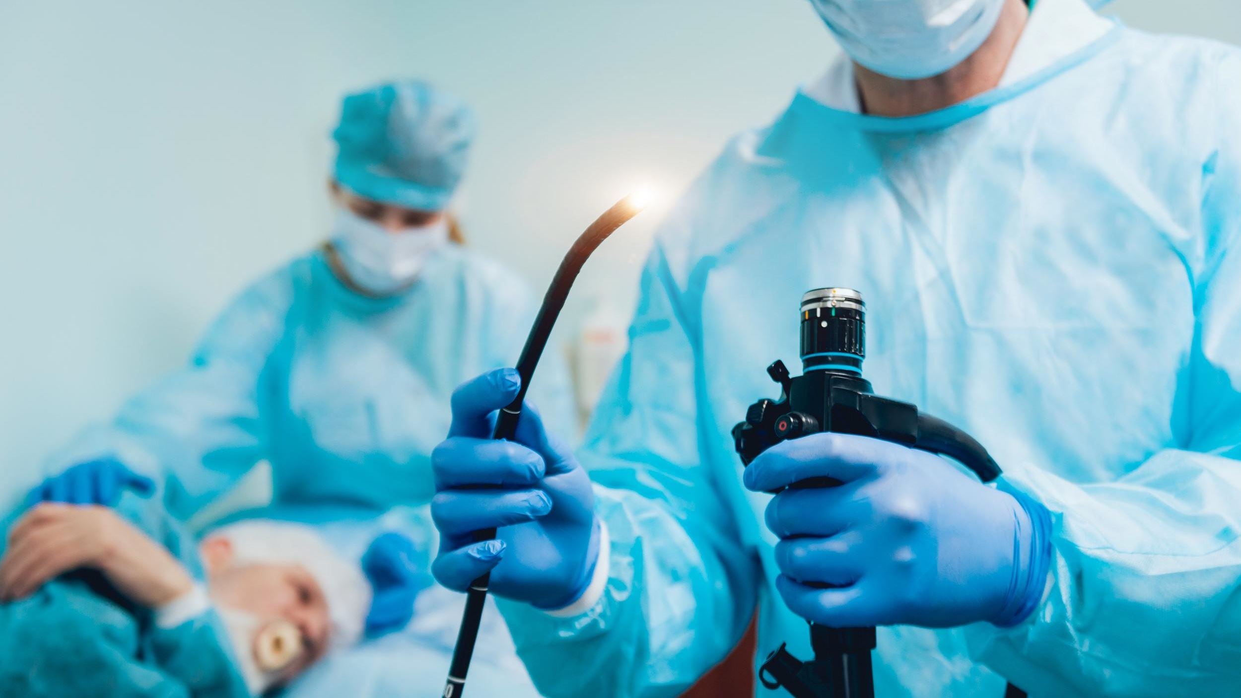 Doctor holding endoscope before gastroscopy